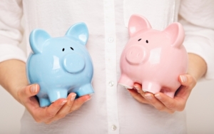 Woman Holding Two Coin Banks