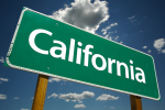 Green California Road Sign with Dramatic Clouds and Sky.